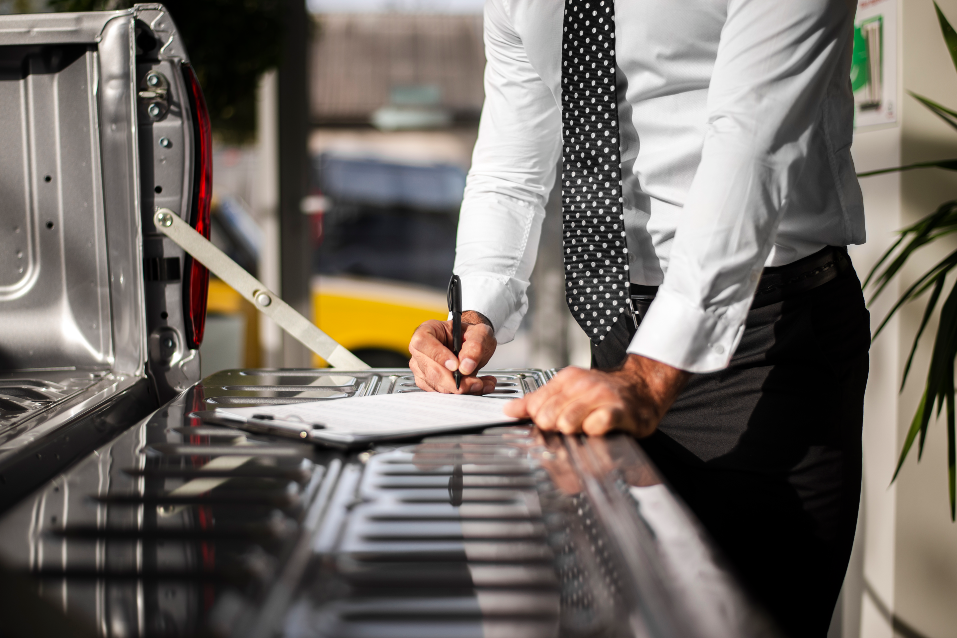 close-up-male-checking-clipboard-list